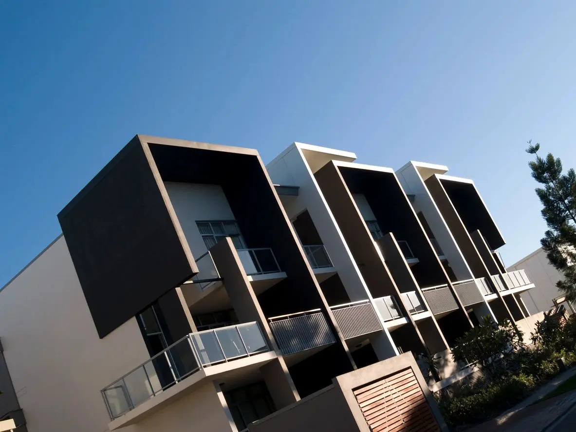 Modern apartment building with angular design.